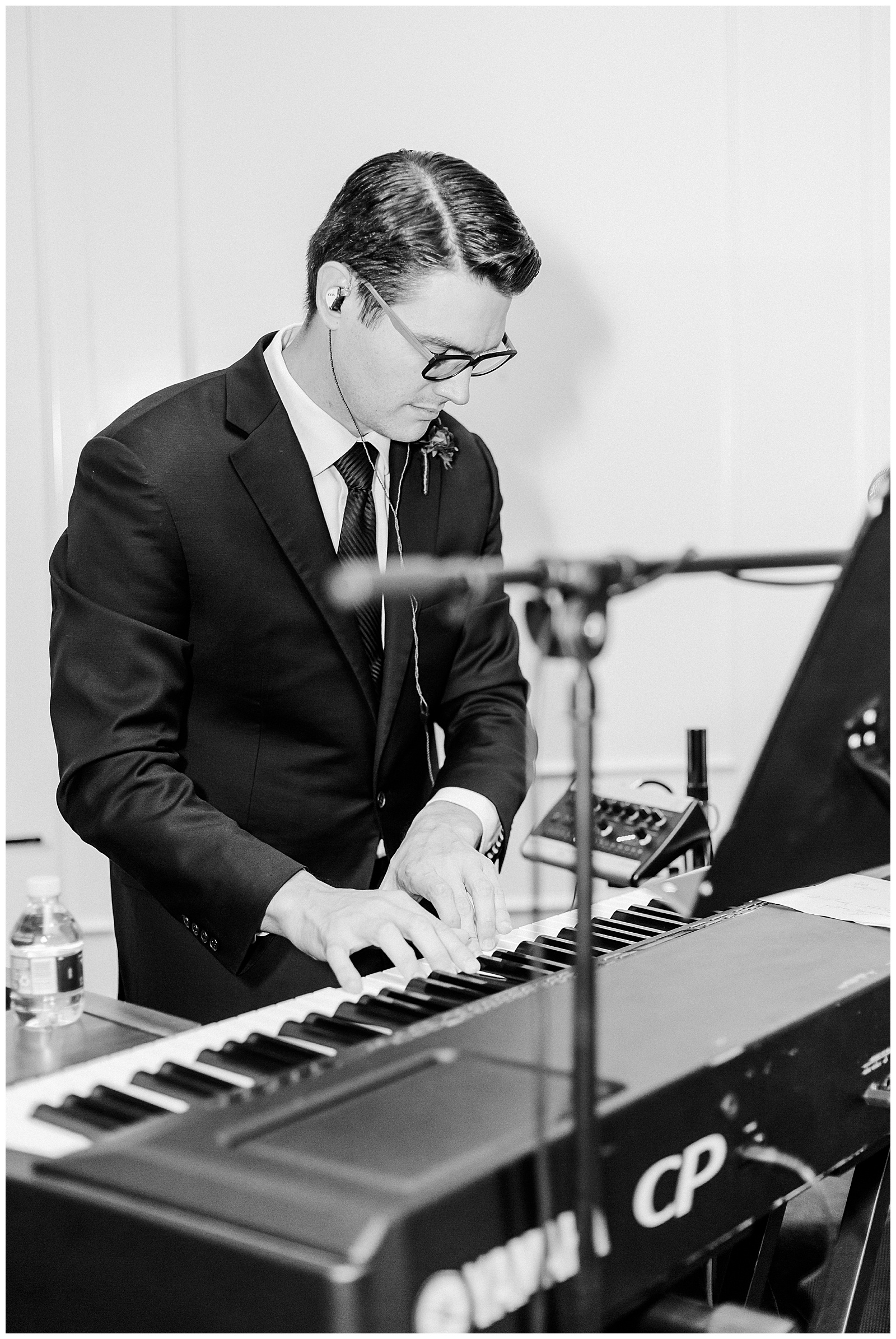 Musician playing piano at wedding