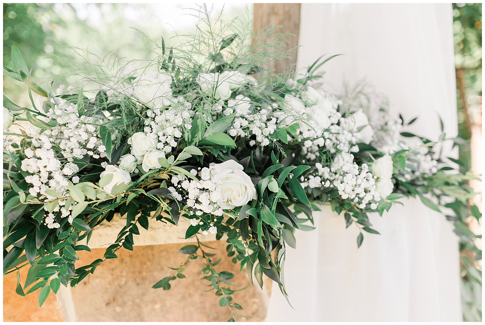 White floral detail at backyard ceremony