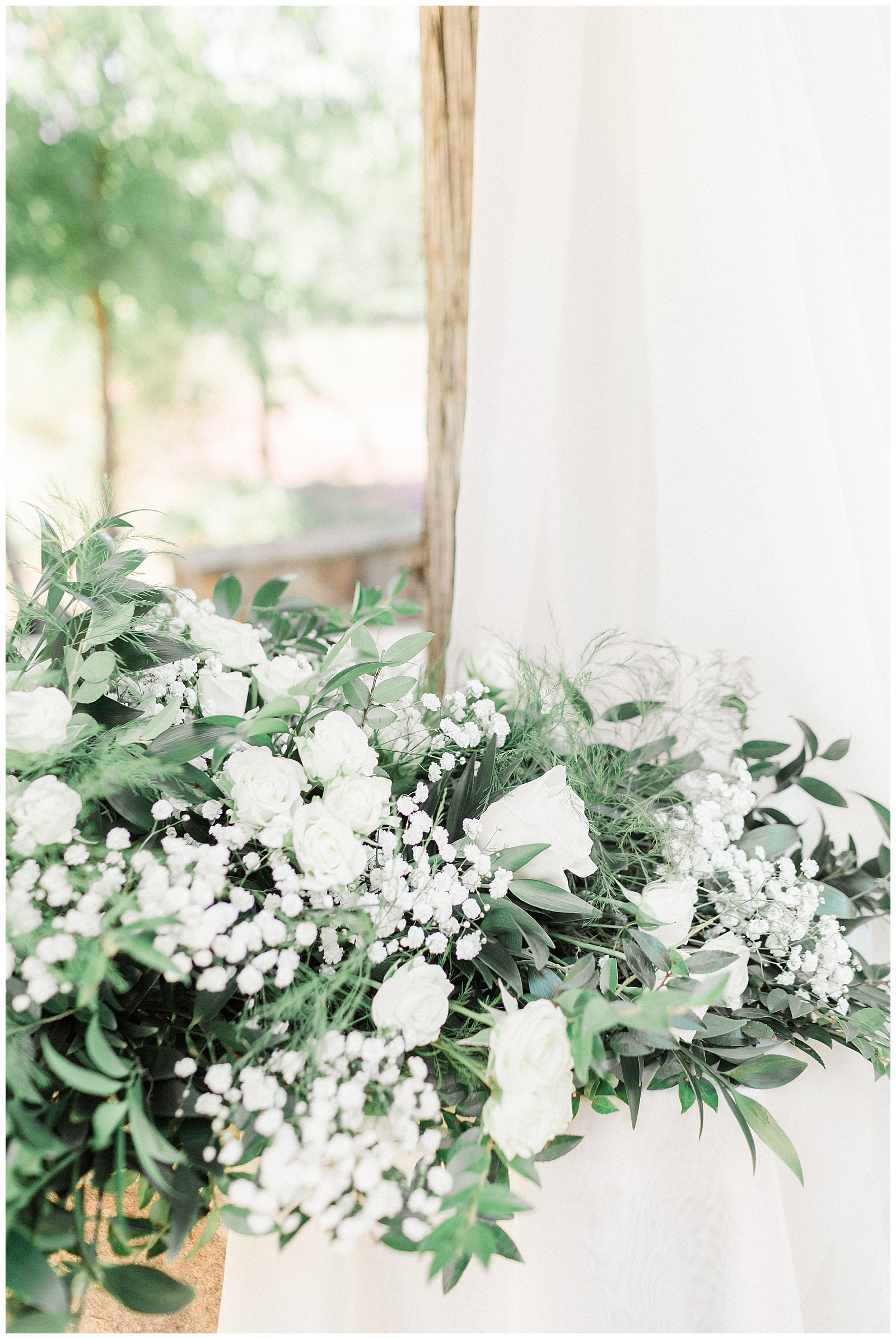 White floral detail at backyard ceremony