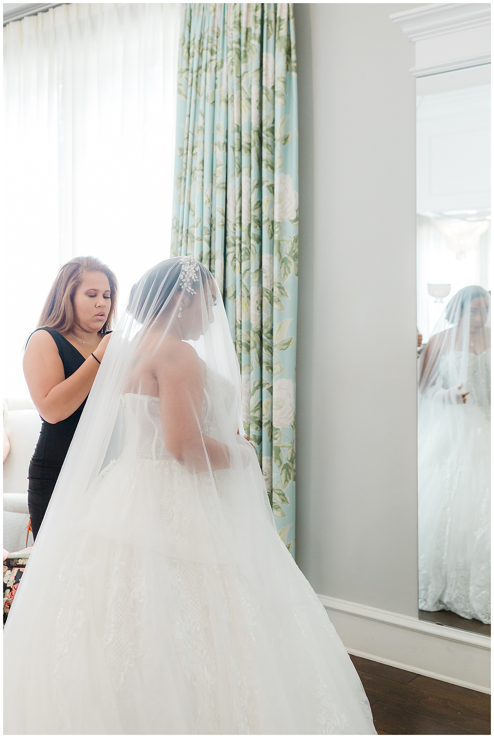 daughter helping mom get ready on wedding day