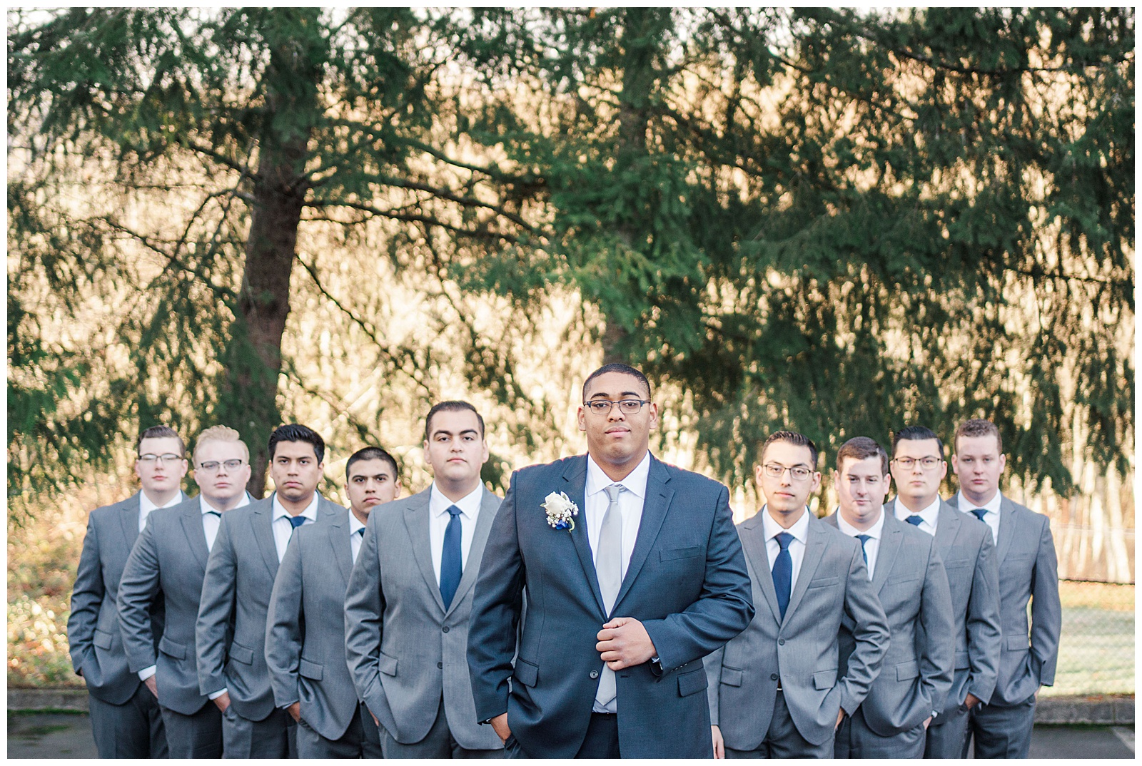Groom with groomsmen in gray and blue suits