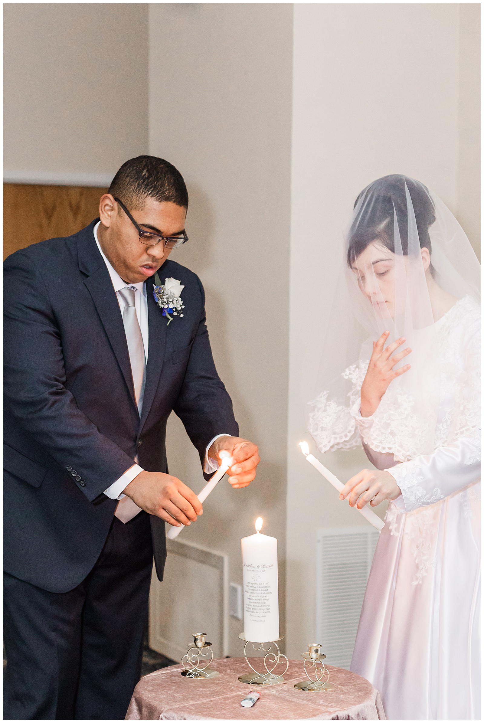 Bride and groom lighting candles