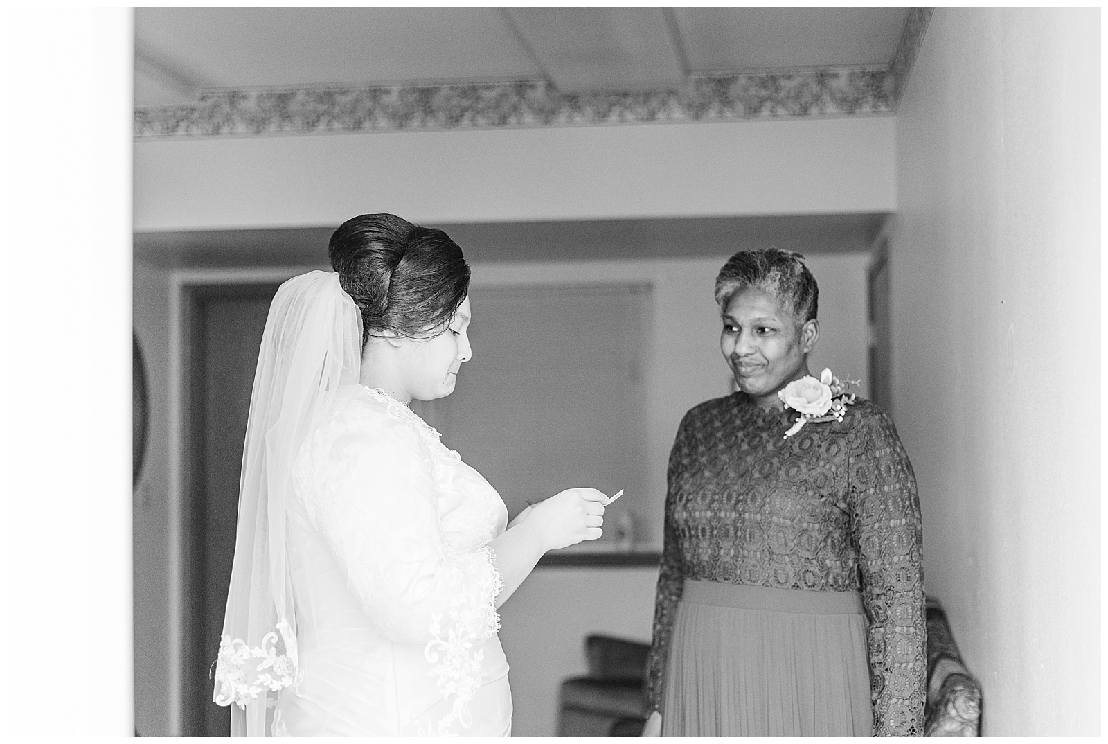 Mother of bride giving bride a gift