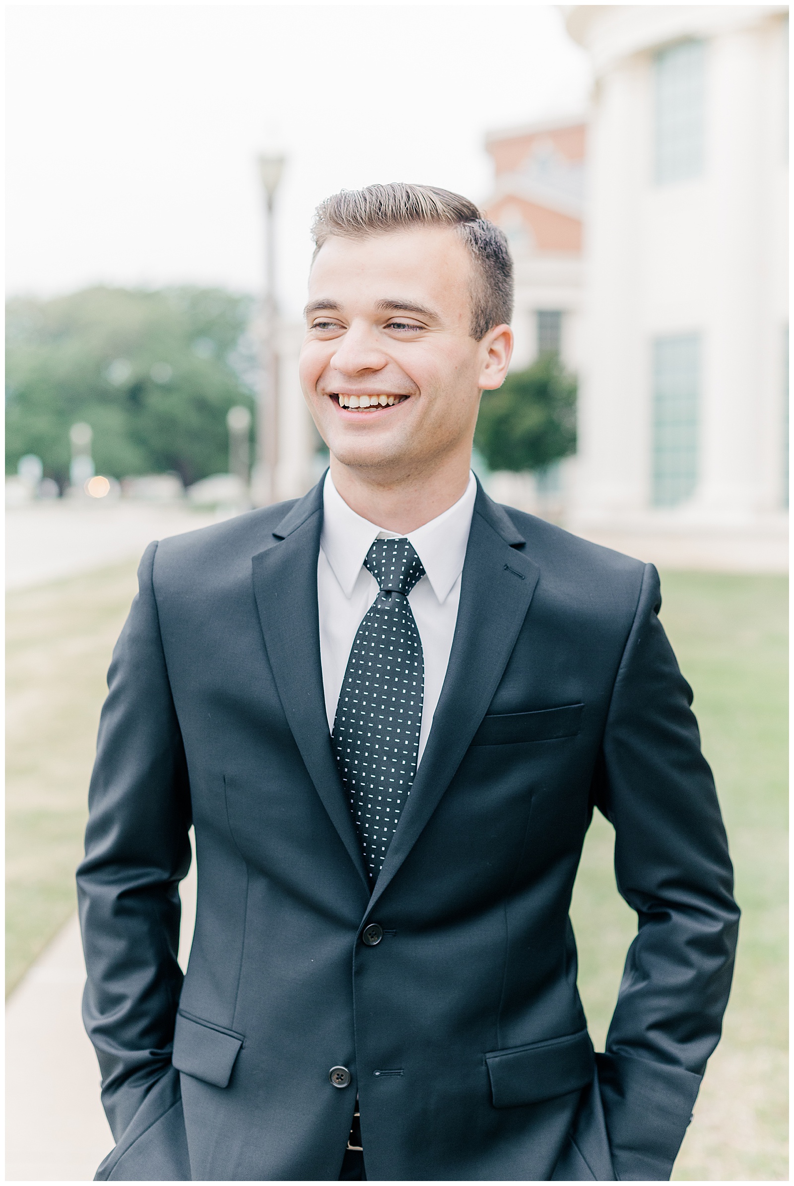 Groom laughing with hands in pocket