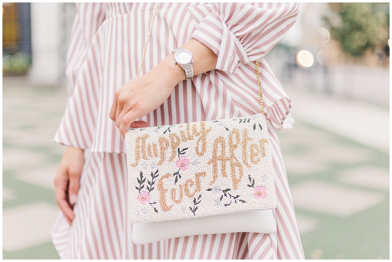 Bride holding "Happily Ever After" purse